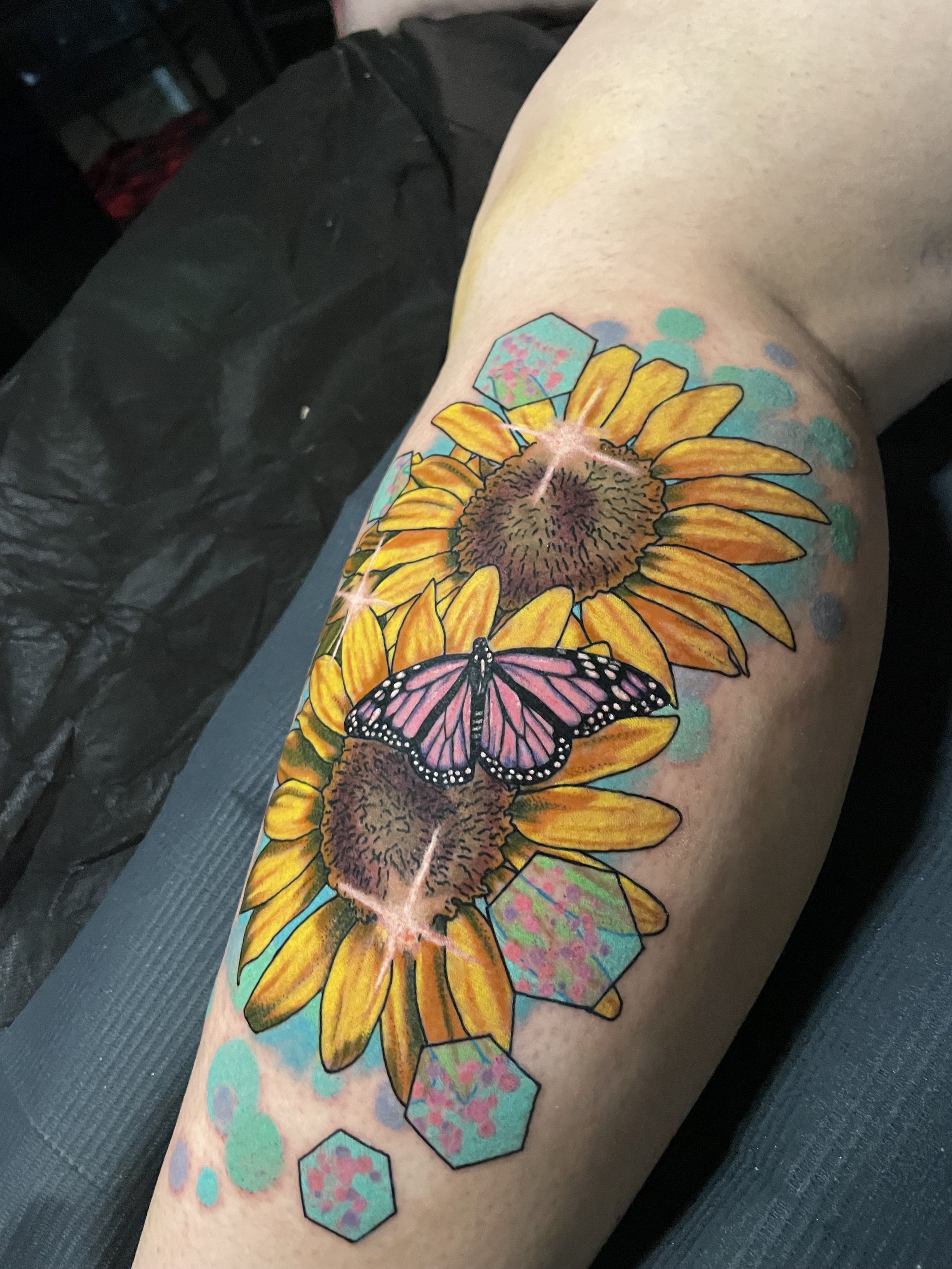  sunflowers with twinkling stars and a butterfly in color tattoo