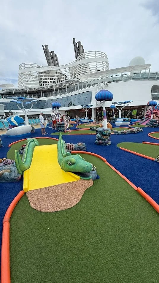 One of the things people don&rsquo;t always expect on a cruise with Royal Caribbean International is just how many little activities are built into the day, like mini golf at sea.

A lot of their ships have mini golf courses onboard, and it ends up b