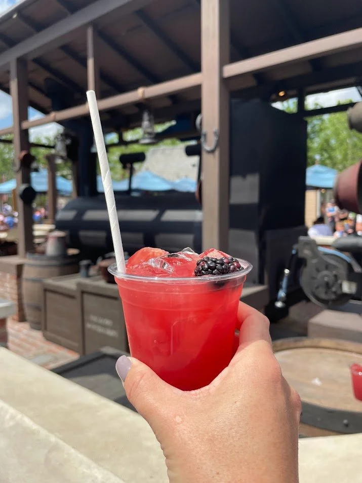 Happy National Moonshine Day!

Some Epcot drinks come and go, but the Moonshine Sour from the outdoor bar at Regal Eagle Smokehouse has stayed one of our absolute favorites year after year. Made with Ole Smoky Blackberry Moonshine, lemon juice, and b