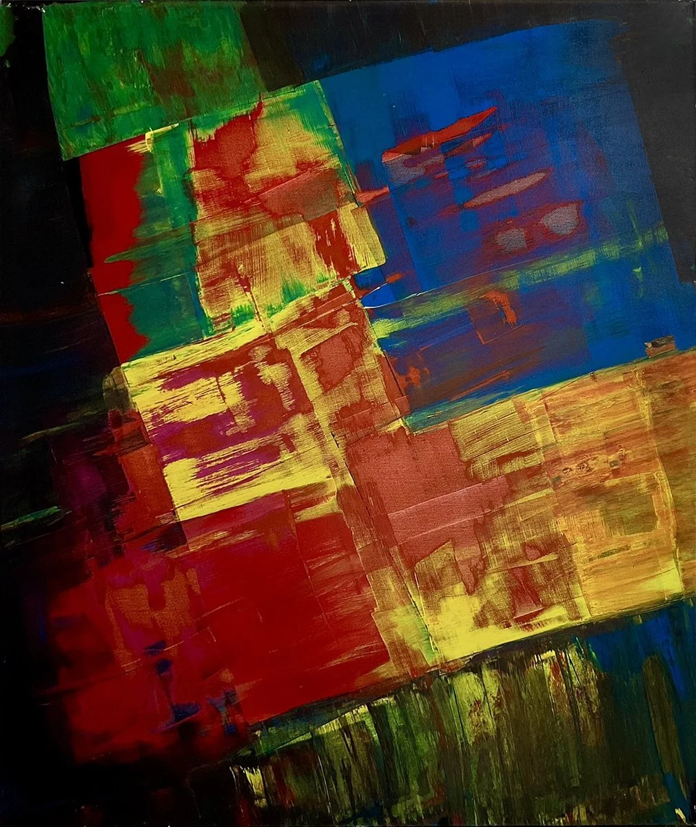 Tilted blocks of red, green, blue and yellow against black