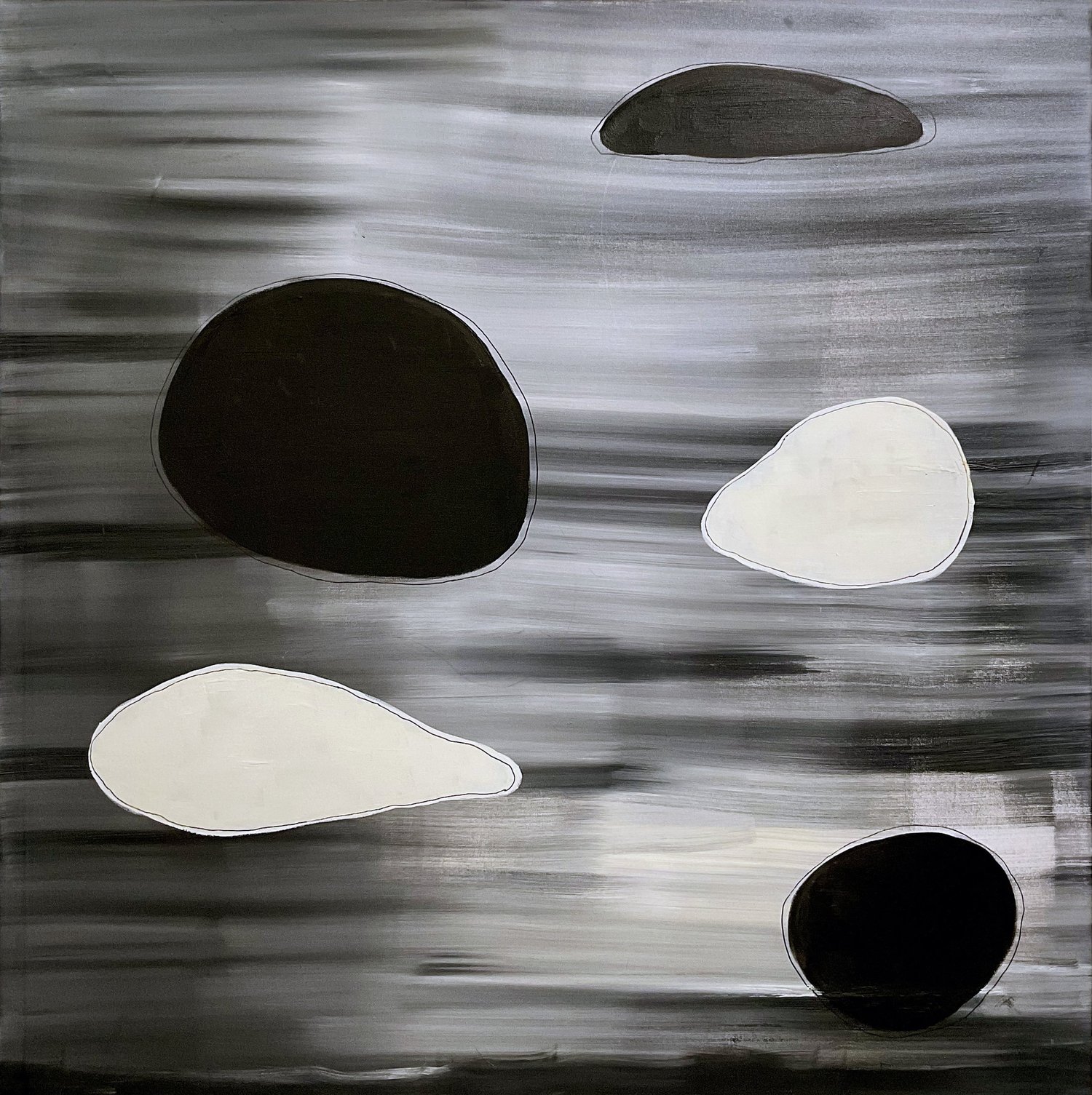 Dark and pale forms floating before a blurred grey field