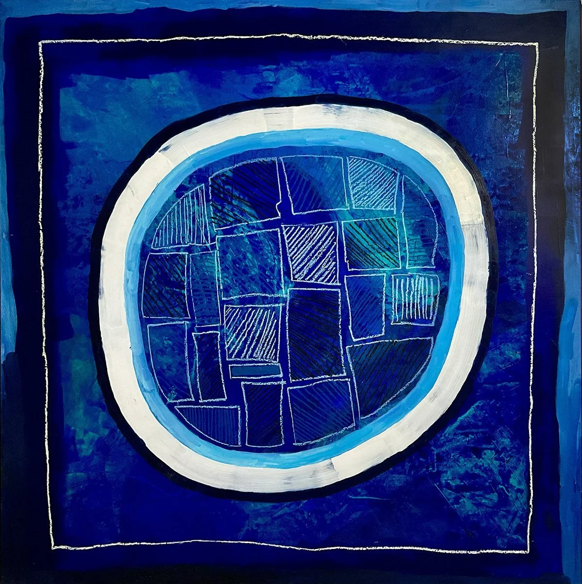 A white ring around a gridded blue field