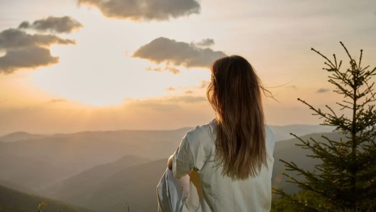 Women facing the mountains at sunset. Through this work you'll shift your awareness and gain clarity through healing and mentoring. Located at sound of Belgrade MT, in the Gallatin Valley. Sessions offer in-person or remotely.