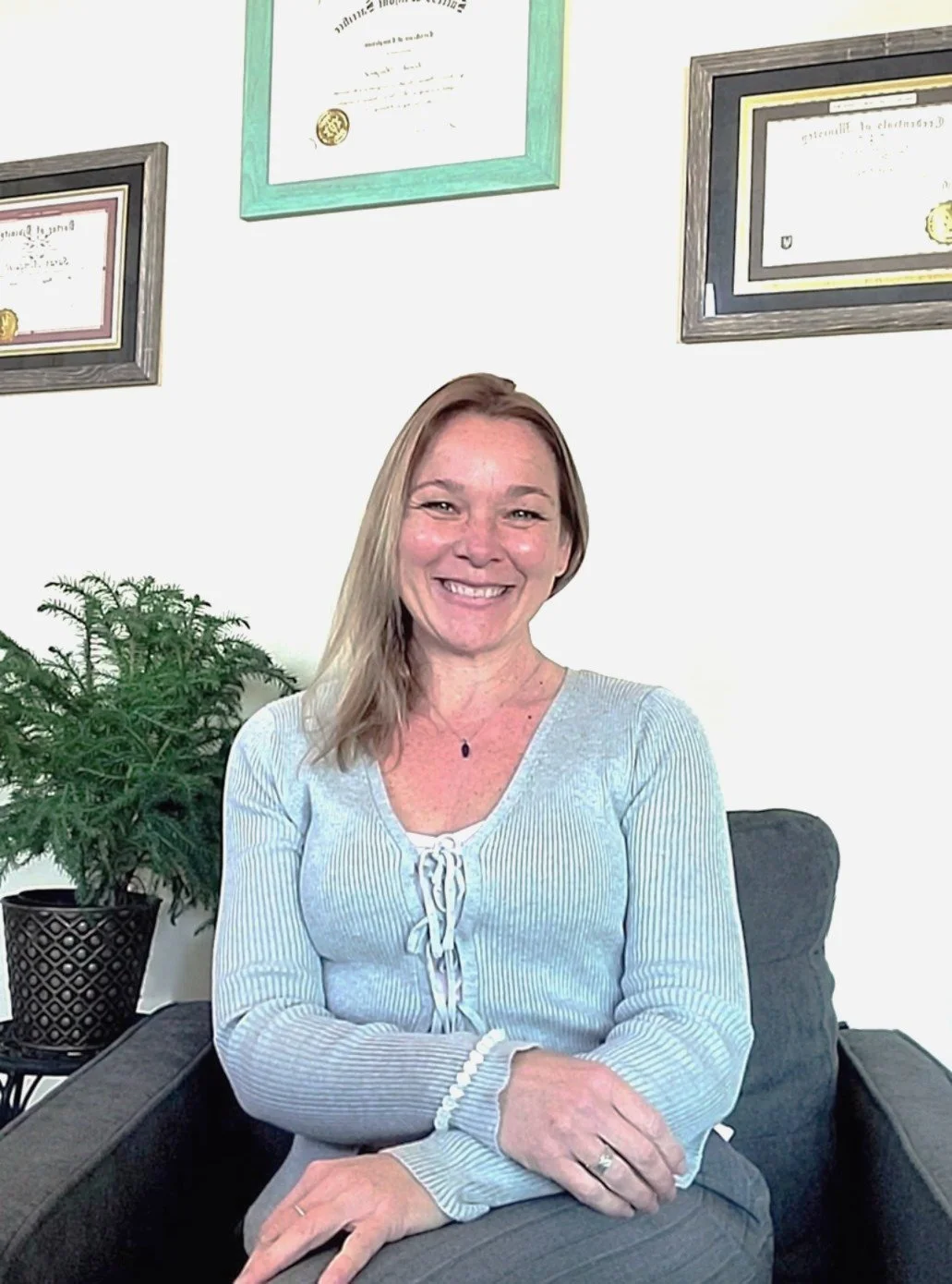 Sarah sitting in a chair. I'm a certified Master Healer and Spiritual Life coach. Take a journey with me into the depths of you. You have all of the answers within you.