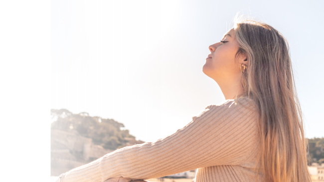 Women sitting in the sunshine. Distance energy medicine and life coaching sessions to support emotional balance and calm.