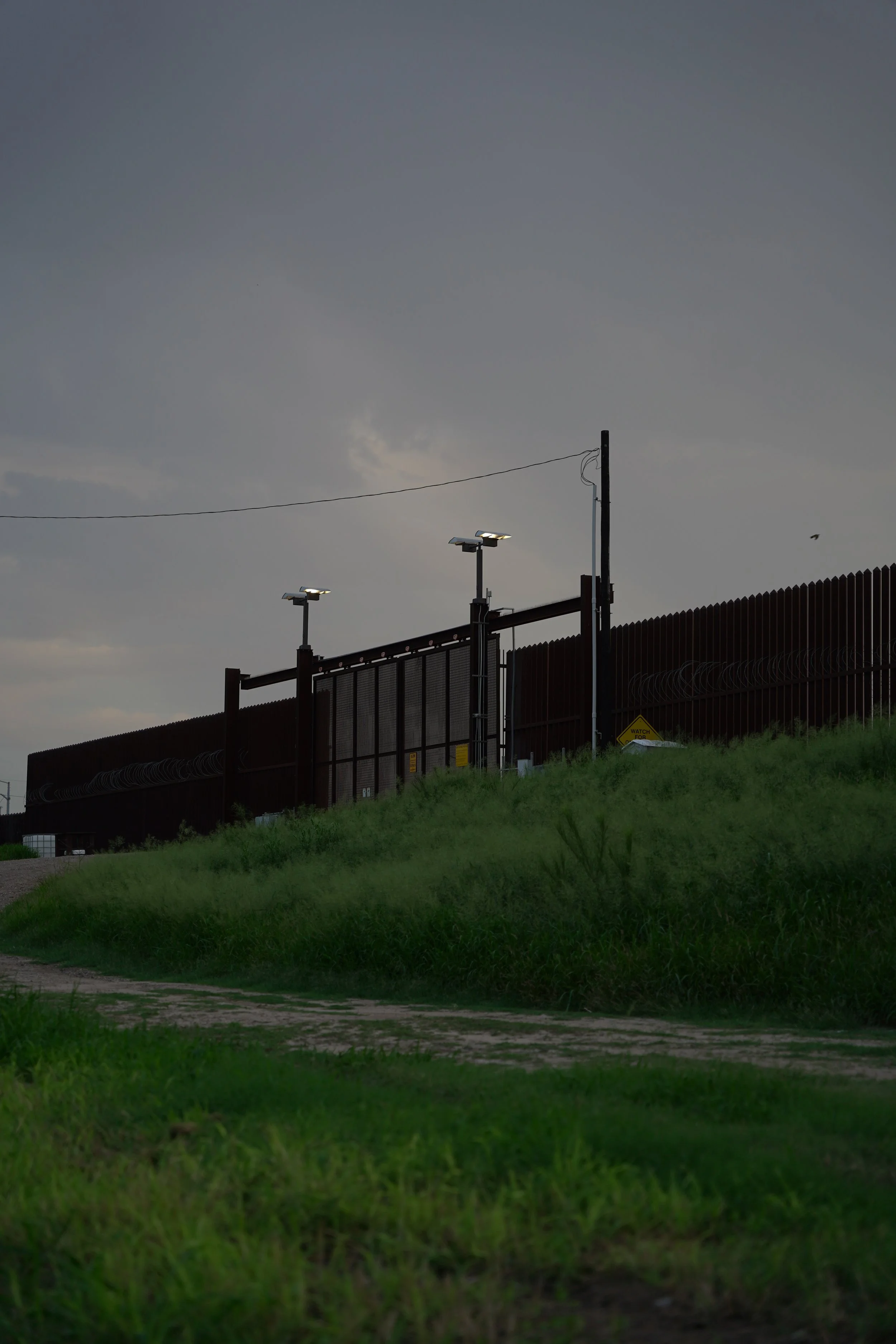 McAllen-Hidalgo International Bridge (US Side) (note: there is another non-visible border wall on the end of the tall border wall)