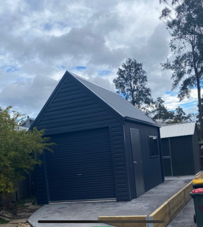 Shed with roller door, door and window, gable roof