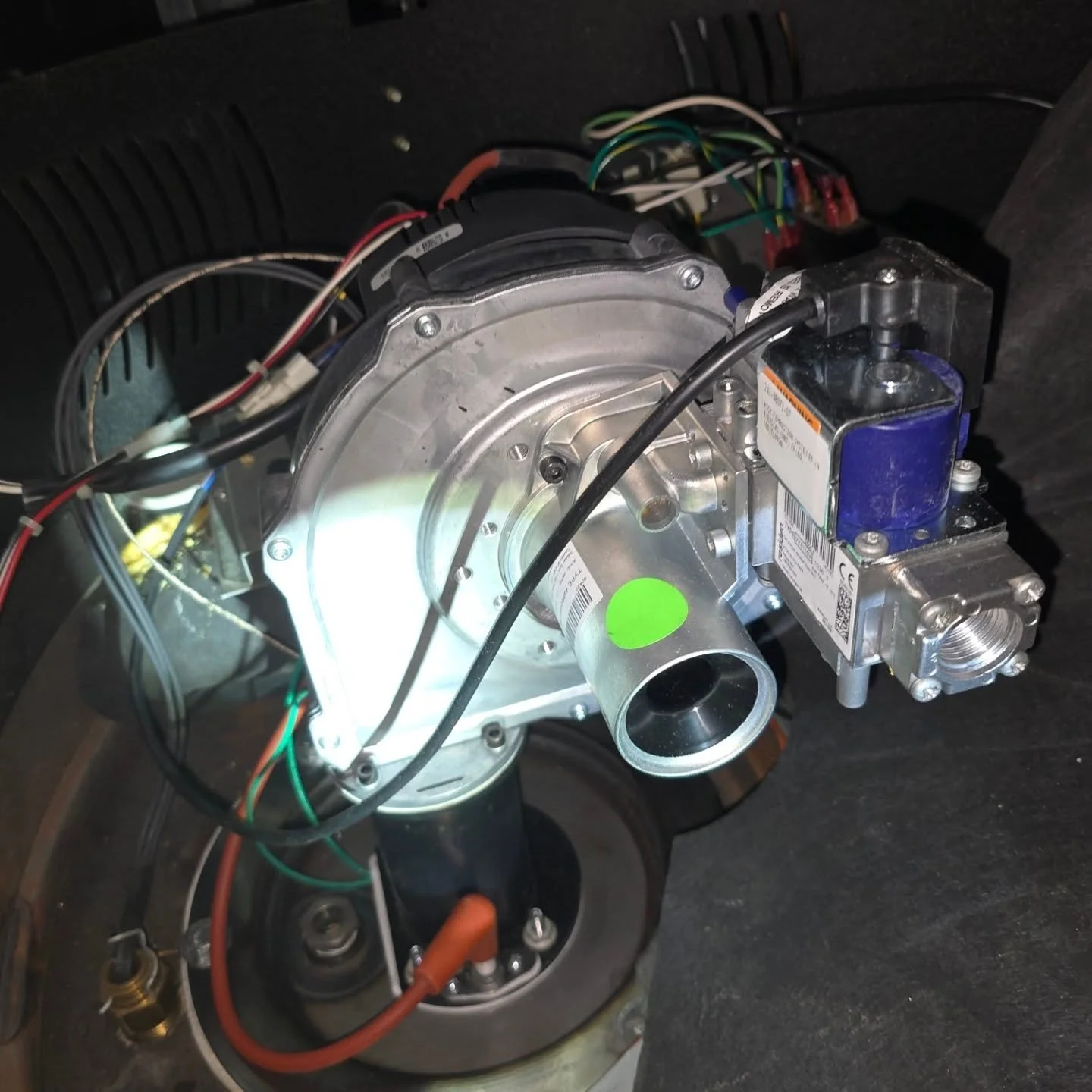 Late shenanigans replacing a burner assembly on a 100 gallon 200k btu water heater after vacuuming out the burner chamber. I replaced the pressure switch since another company came out.after me and messed with it as well. Once all that was done the h