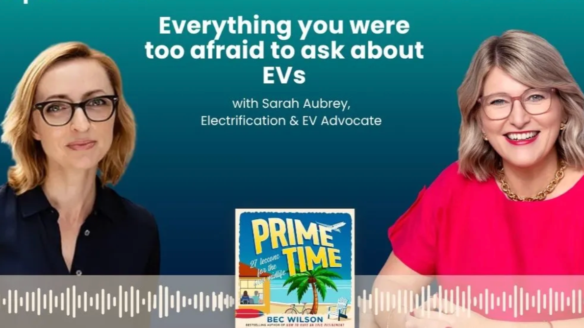 A promotional graphic featuring two women with glasses, one with blonde hair wearing a black top and the other with light brown hair in a pink top with a gold chain, smiling against a teal background. The text reads 'Everything you were too afraid to ask about EVs' with Sarah Aubrey, Electrification & EV Advocate. There is an image of a book titled 'Prime Time: 97 Lessons from the Middle.'