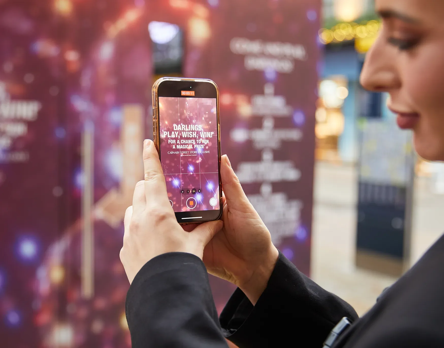 Charlotte Tilbury Photo booth, someone taking a photo