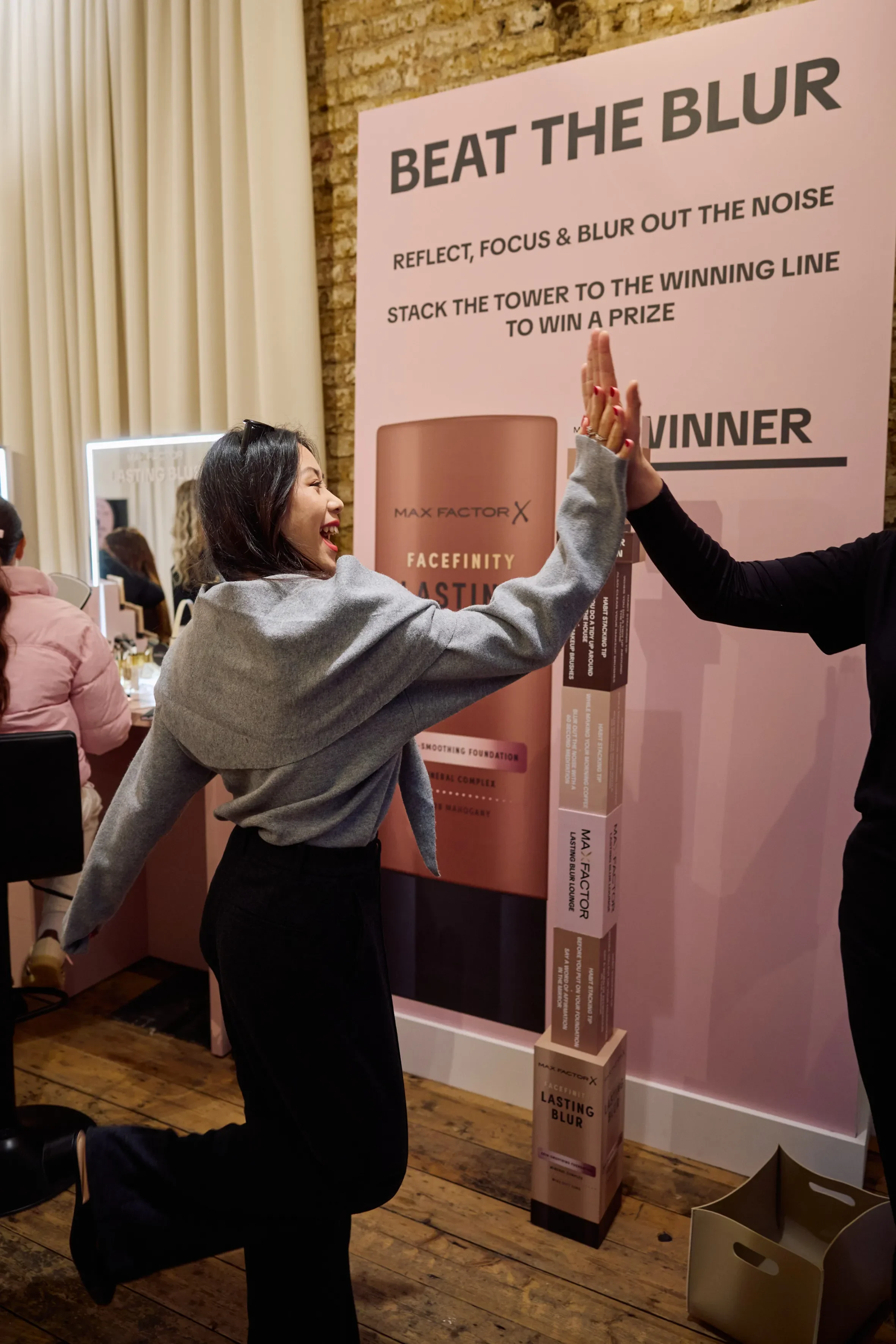 Max Factor - Customer high fiving