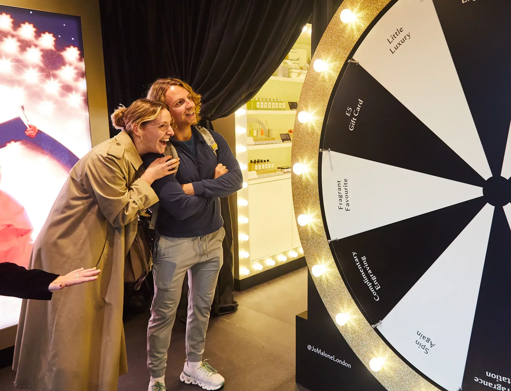 Jo Malone London, The Christmas Special Pop-up, Top UK Experiential Marketing Agency - Customers enjoying spinning wheel