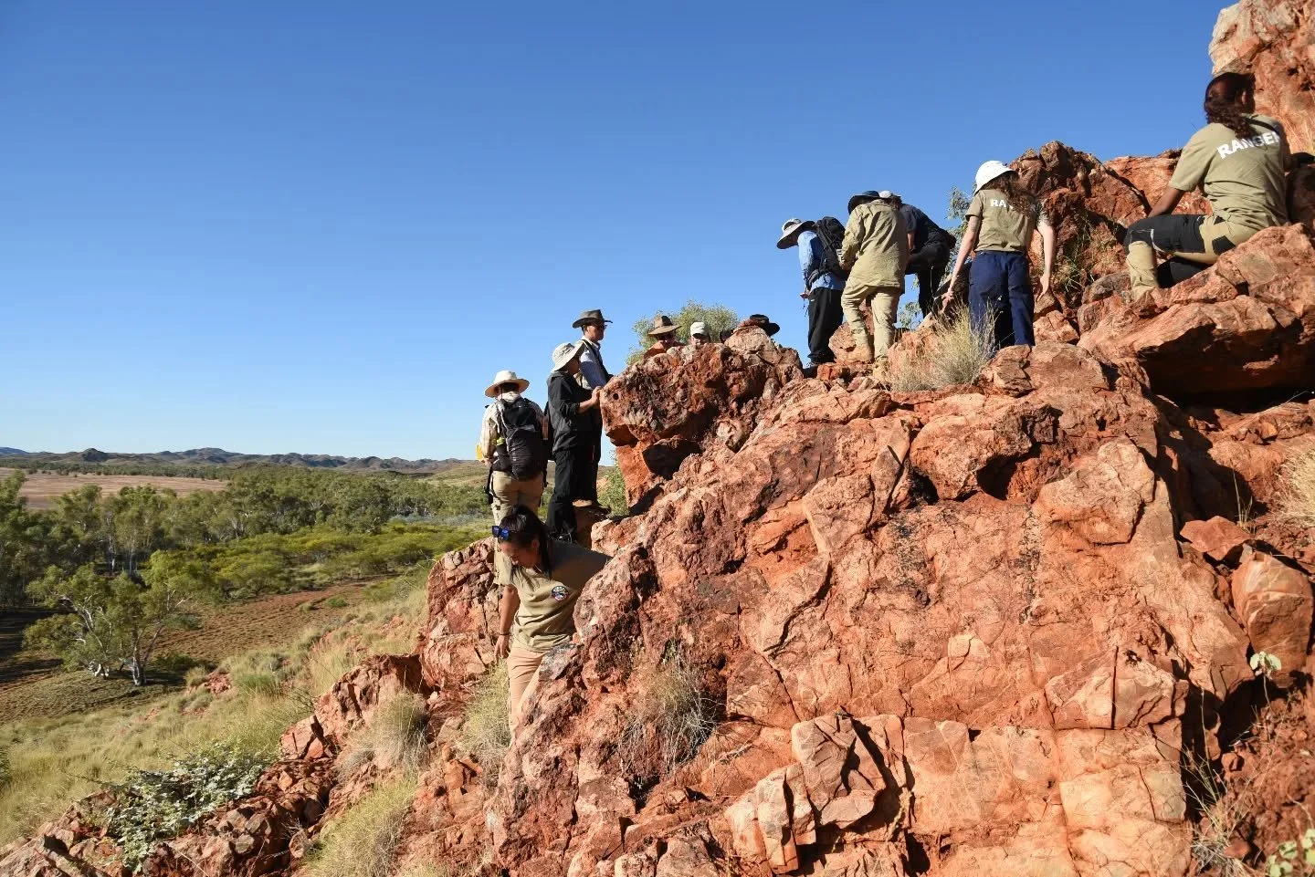 Entry 1️⃣ in the AP Photo Comp 2025.

1. Adele Pentland &ndash; The most thrilling discoveries are made together. Professor Martin Van Kranendonk from Curtin University and colleagues marvel at the ~3.43 billion-year-old stromatolites from the Strell