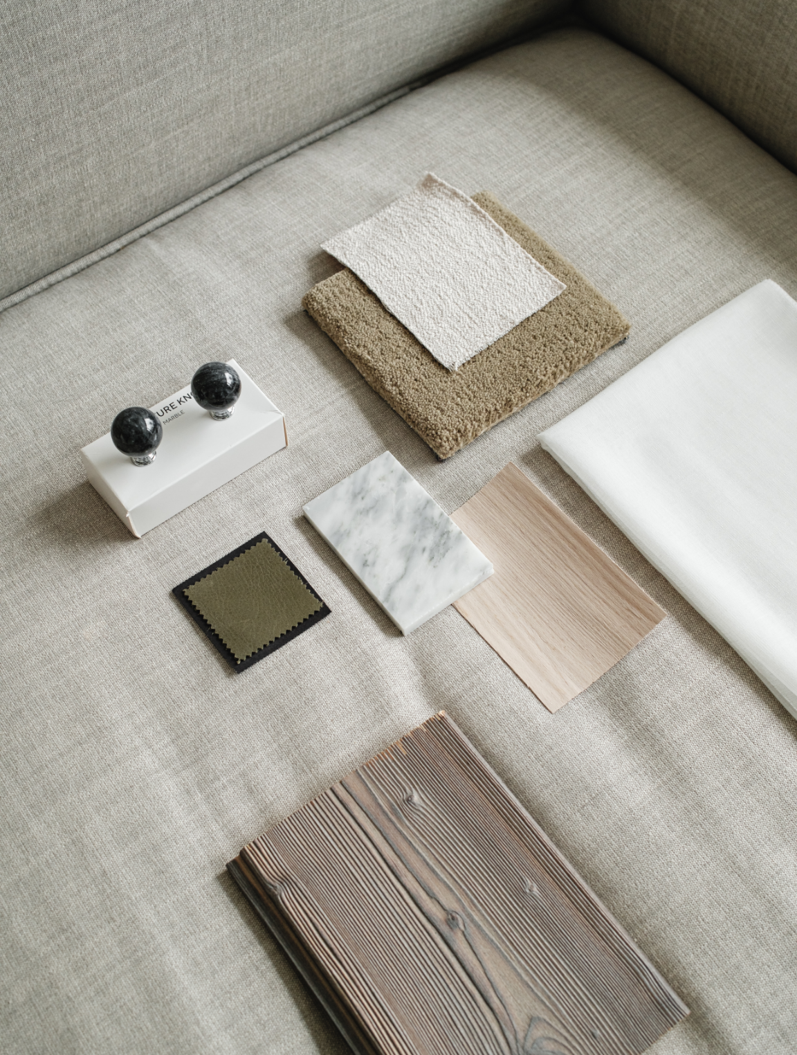 kaboompics_interior-design-material-board-home-styling-a-neutral-color-scheme-fabric-samples-35118.png