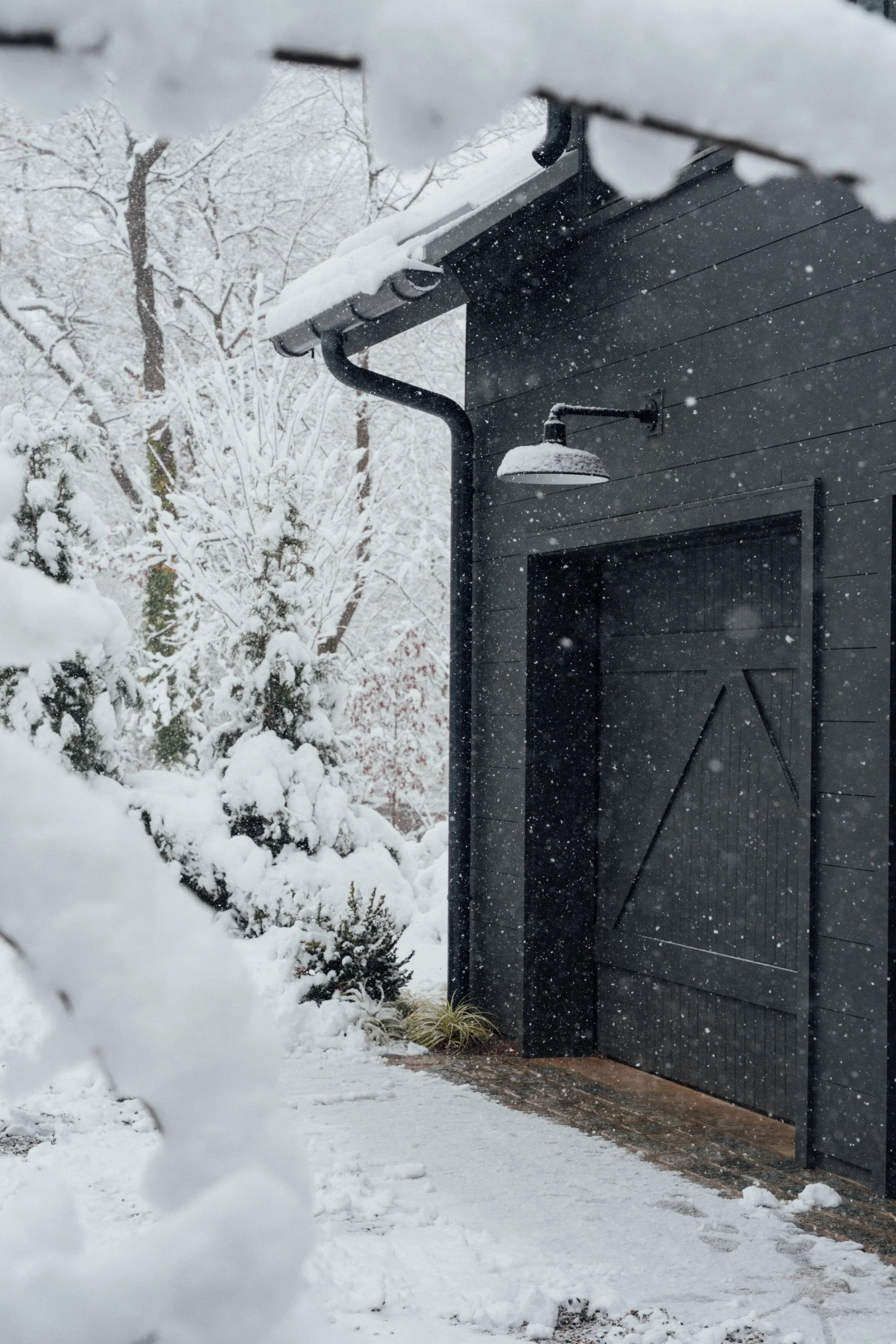 modern-home-black-siding-snowstorm-architectural-photography.jpg