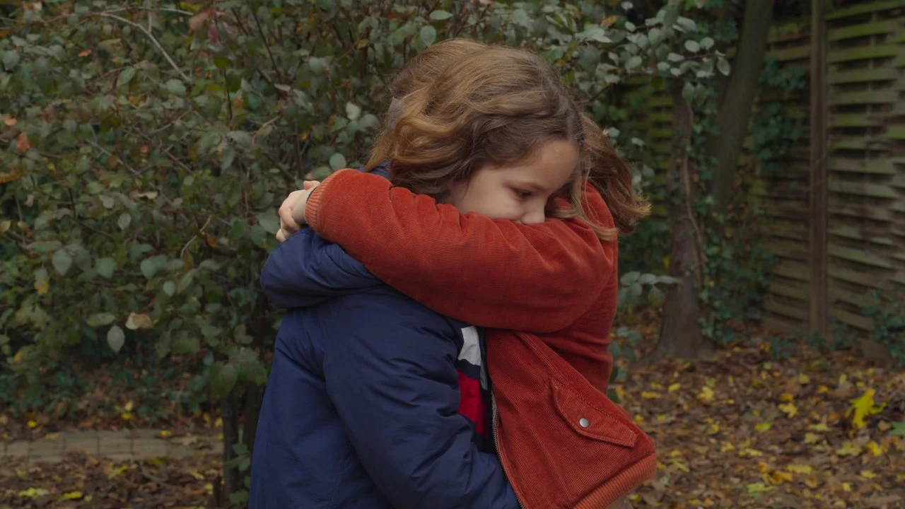 Two girls hugging outdoors - Celine Sciamma - Petite Maman