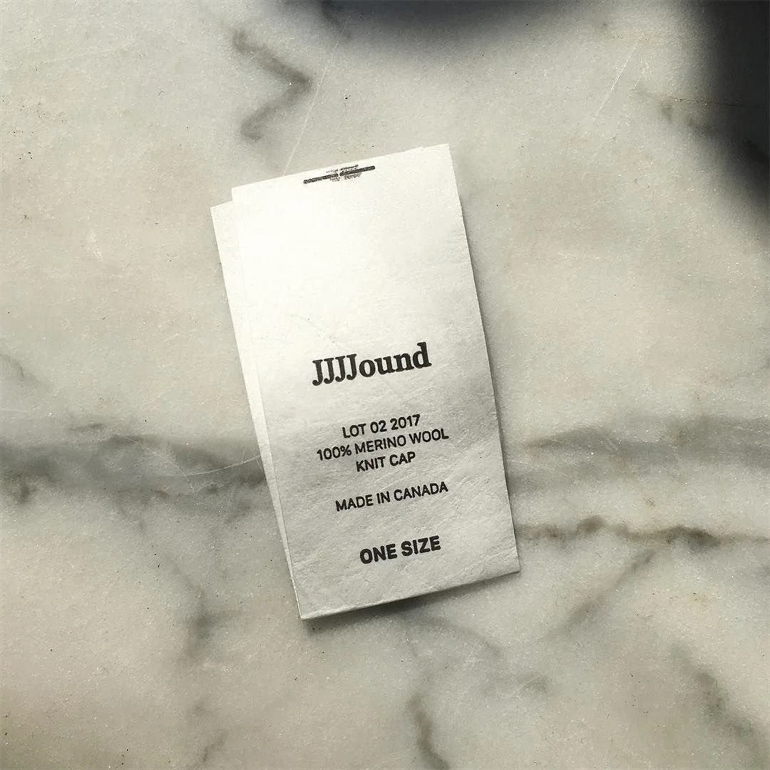 Clothing tag: JJJJound knit cap