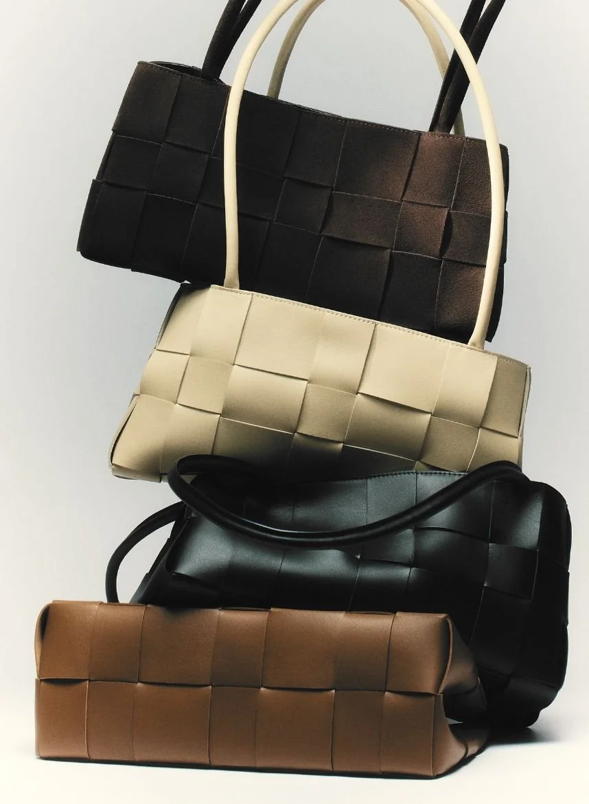 Stacked woven leather handbags