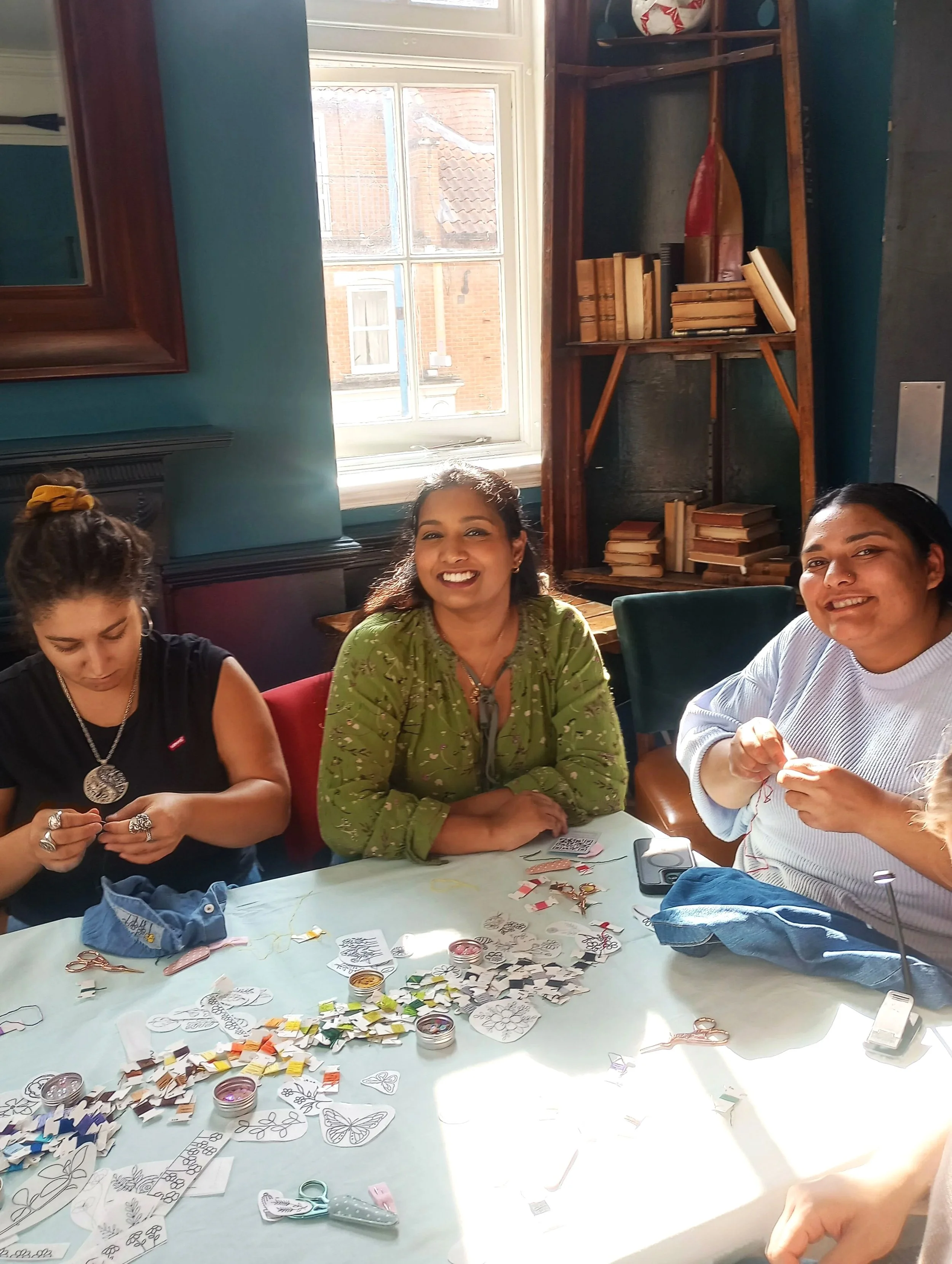 People having a nice time at a creative embroidery workshop
