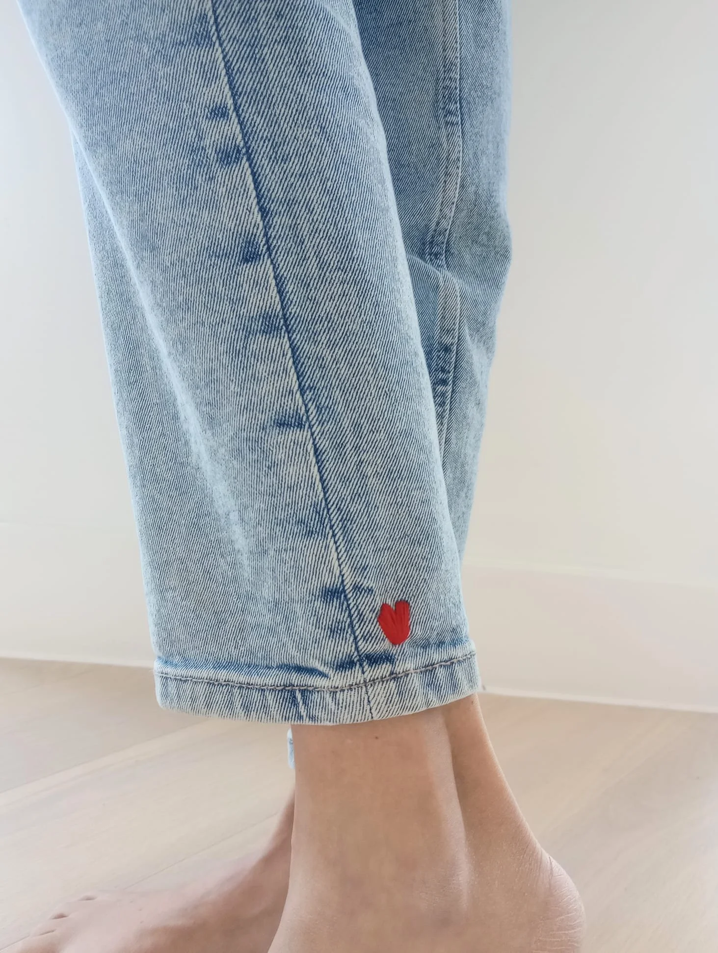 A little hand-stitched red heart on denim