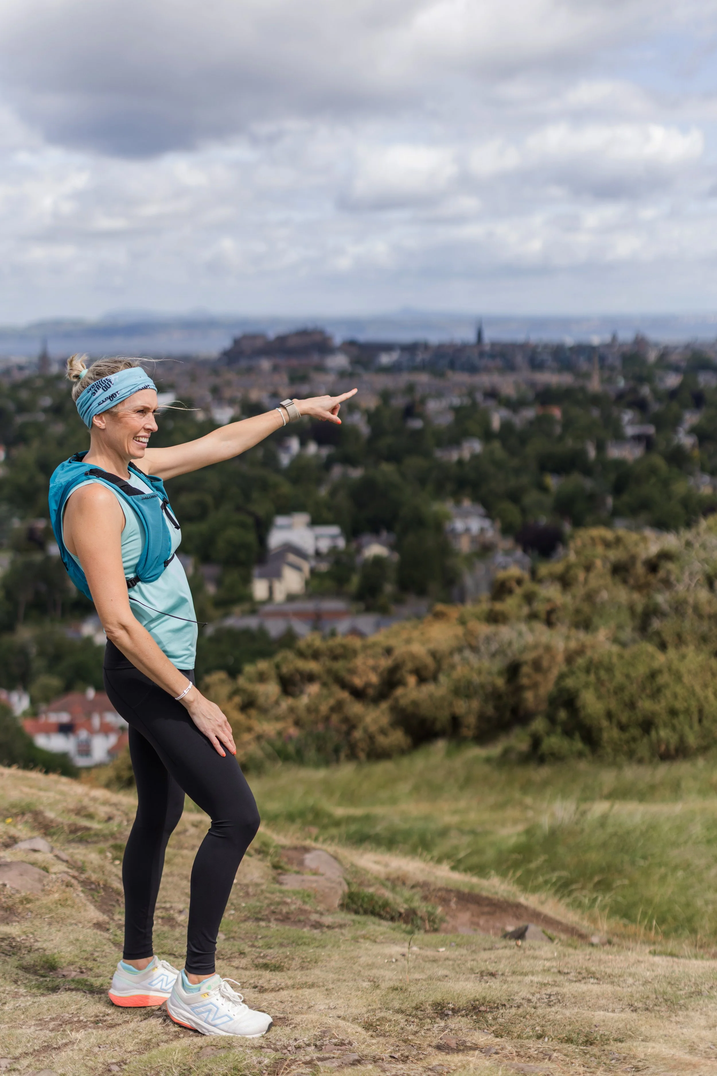 Jayne Lawson from Stride Out Running Tours pointing out landmarks at the top of Blackford Hill, Edinburgh