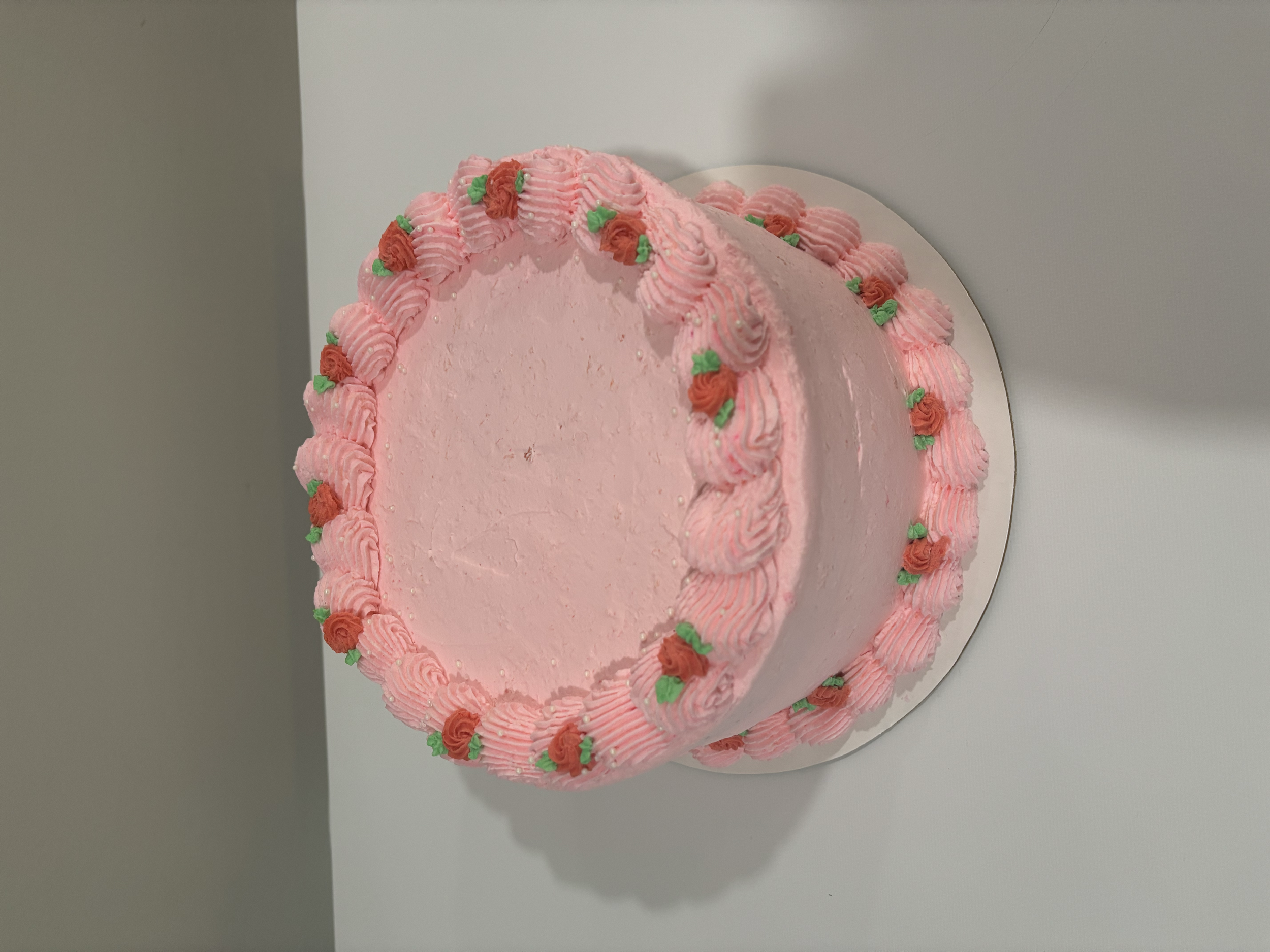 Chocolate raspberry cake with whipped cream frosting