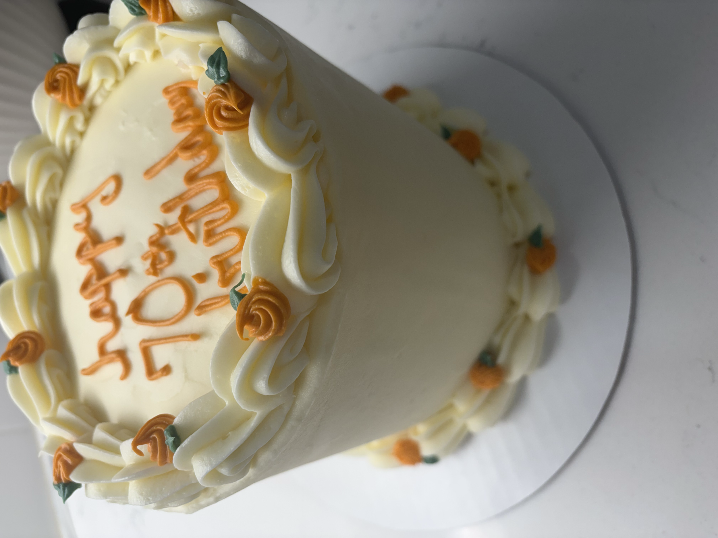 Pumpkin spice cake with small orange flowers