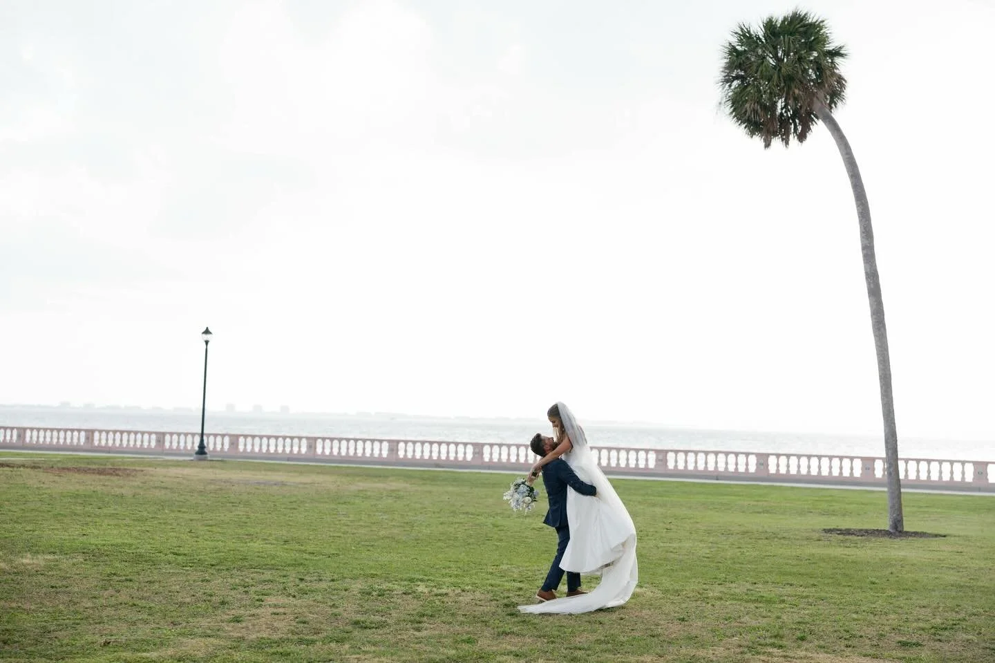 In that moment, the world paused, and it was just them🤍🌴✨
&bull;
&bull;
&bull;
&bull;
Videographer: @iyrus_weddings
Venue: @events.ncf
Planner: @lauradetwilerevents
DJ: @ghamobiledjs
Cake: @sweet_doctors
Caterer: @curatedcatering_events
Photographe