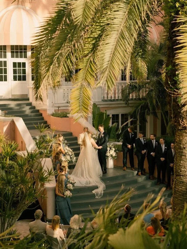 An &ldquo;I do&rdquo; under the palms✨🌴
&bull;
&bull;
&bull;
Photo: @rweberphoto
Venue: @thedoncesarhotel 
Planner: @perfectingtheplan 
Hair + MUA: @lhbridalartistry 
Floral: @benevaweddings 
Dueling pianos: @felixandfingers 
Officiant: @sensational