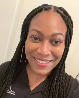 Close up picture of BIPOC therapist.