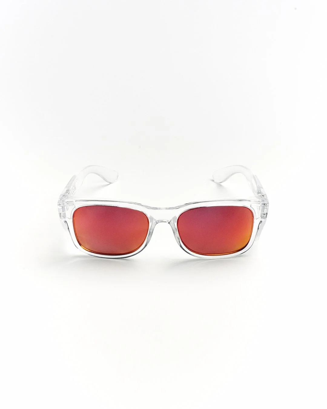 Clear plastic sunglasses with orange tinted lenses on a white background.