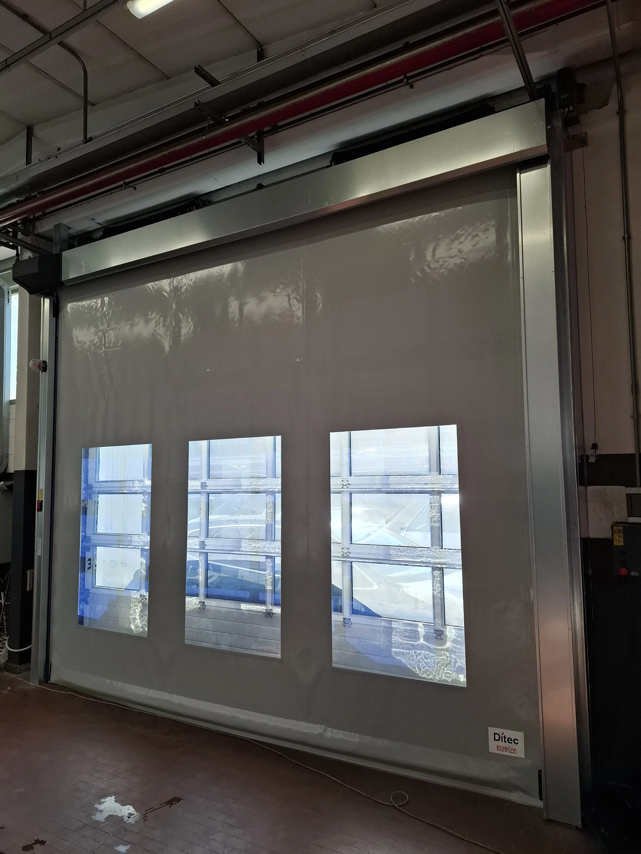Porta ad avvolgimento rapido autoreparabile DITEC