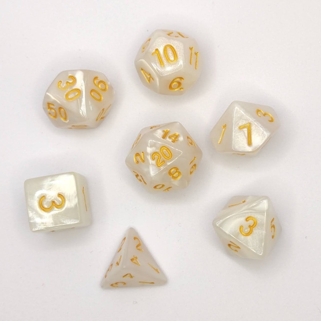 Seven pearlescent white polyhedral dice with gold numbering, arranged on a white background, perfect for tabletop RPGs like DnD and Pathfinder