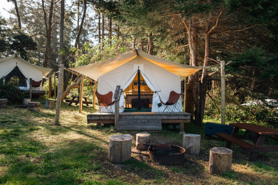 Spacious safari tents at Mendocino Grove set among trees for privacy with ocean views and peaceful surroundings