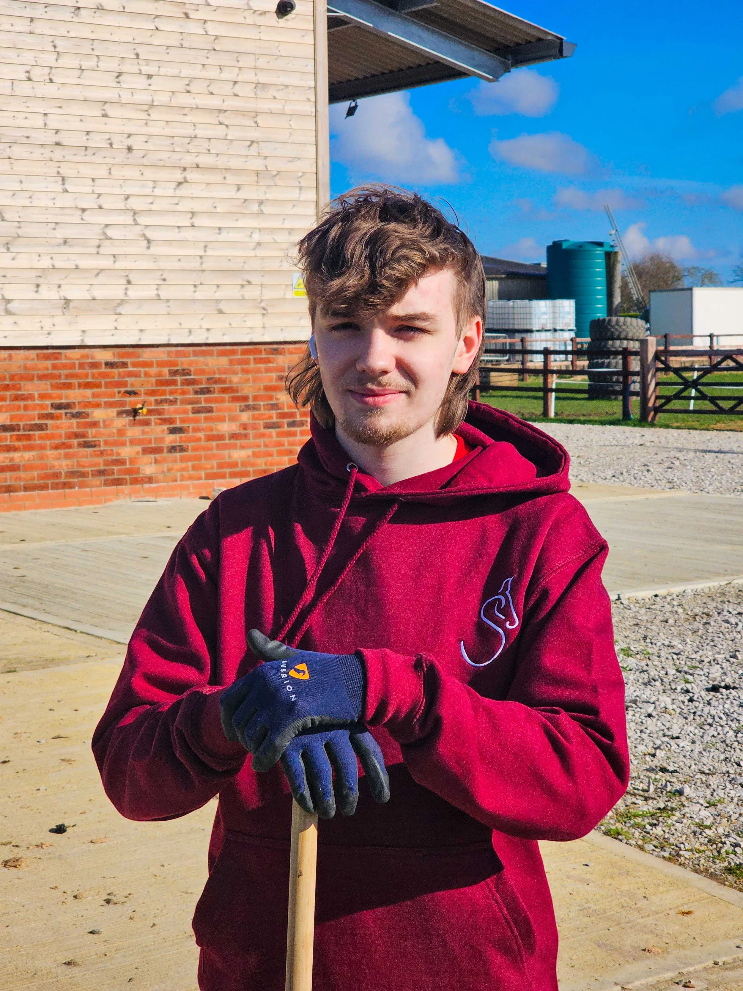 boy-broom-gloves-stables-equine