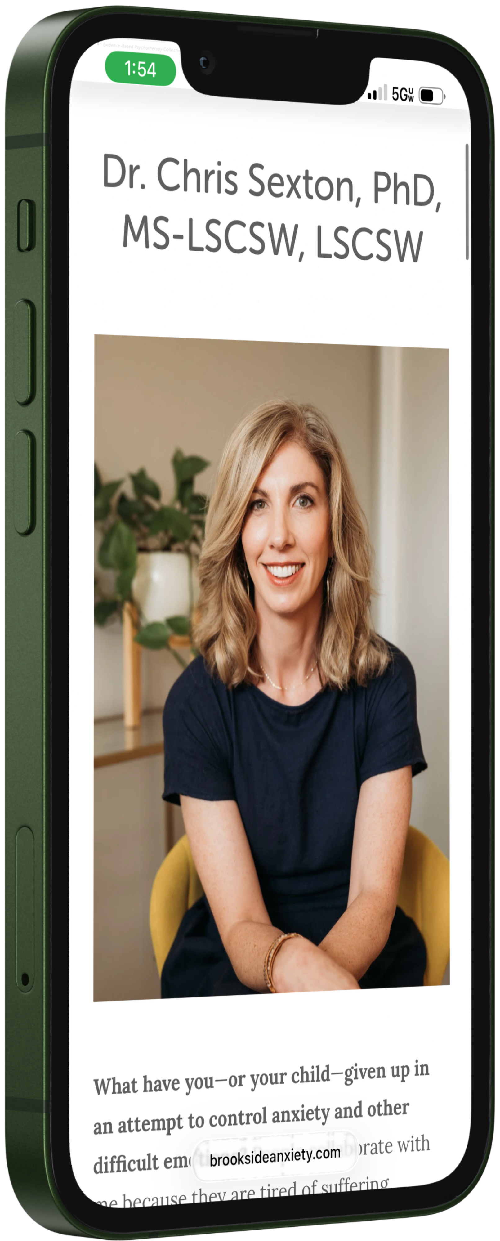 A smartphone screen displaying a portrait photo of a smiling woman with blonde hair, wearing a black shirt, sitting in a room with a plant, and an article about mental health and anxiety.