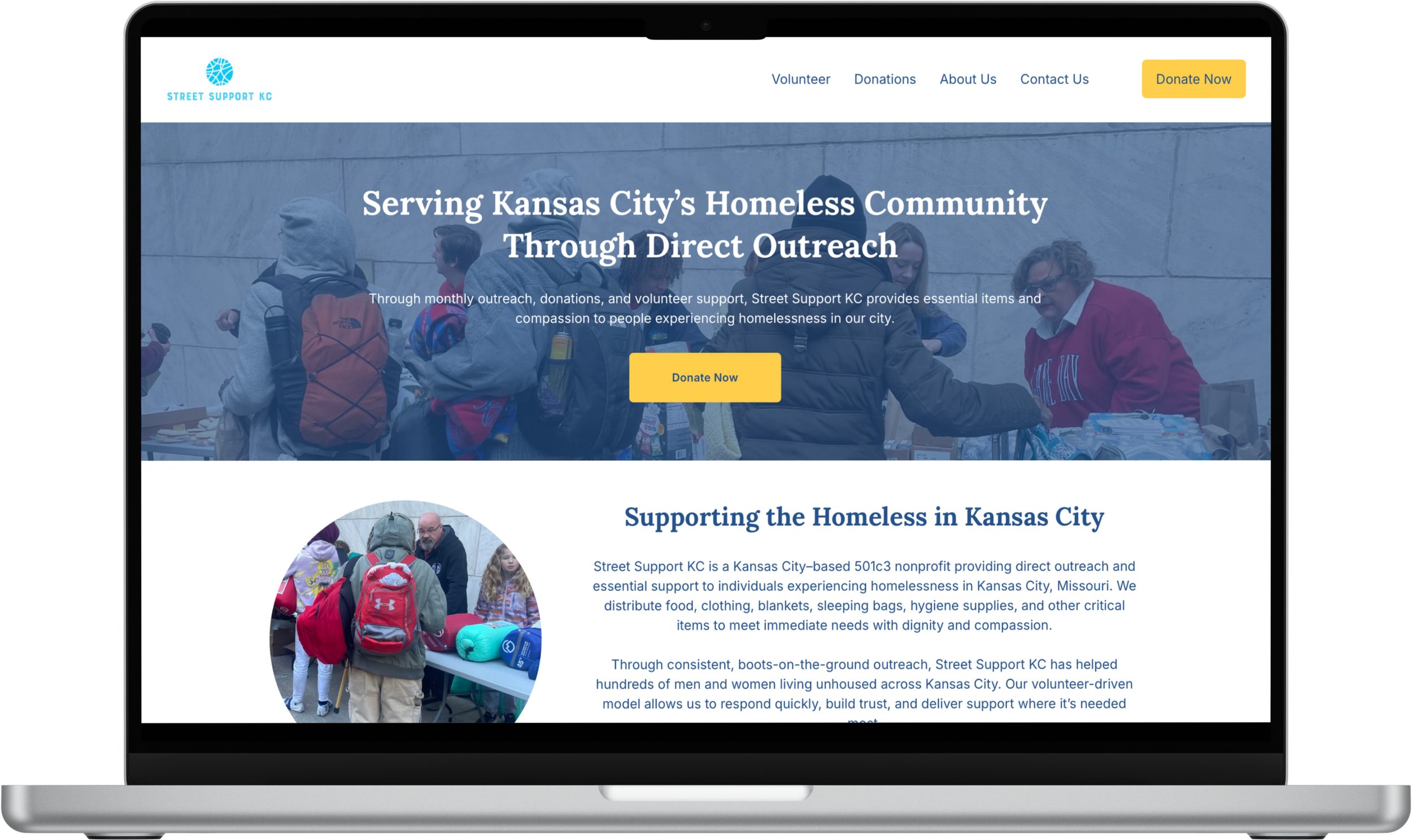 Homepage of Street Support KC website showing image of people at a table distributing supplies, with text about supporting Kansas City's homeless community.