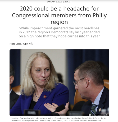 A Congresswoman listens as a male lawmaker talks to her, waving hands from Congressional dais