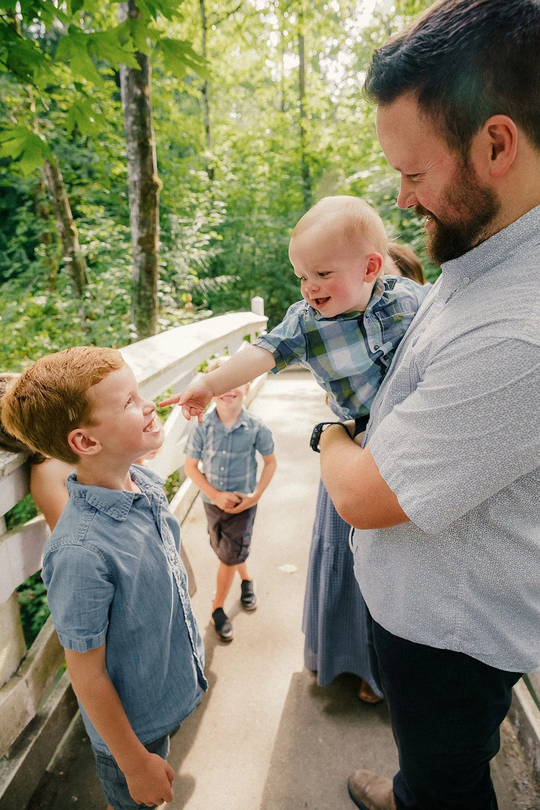 baby points to big brother