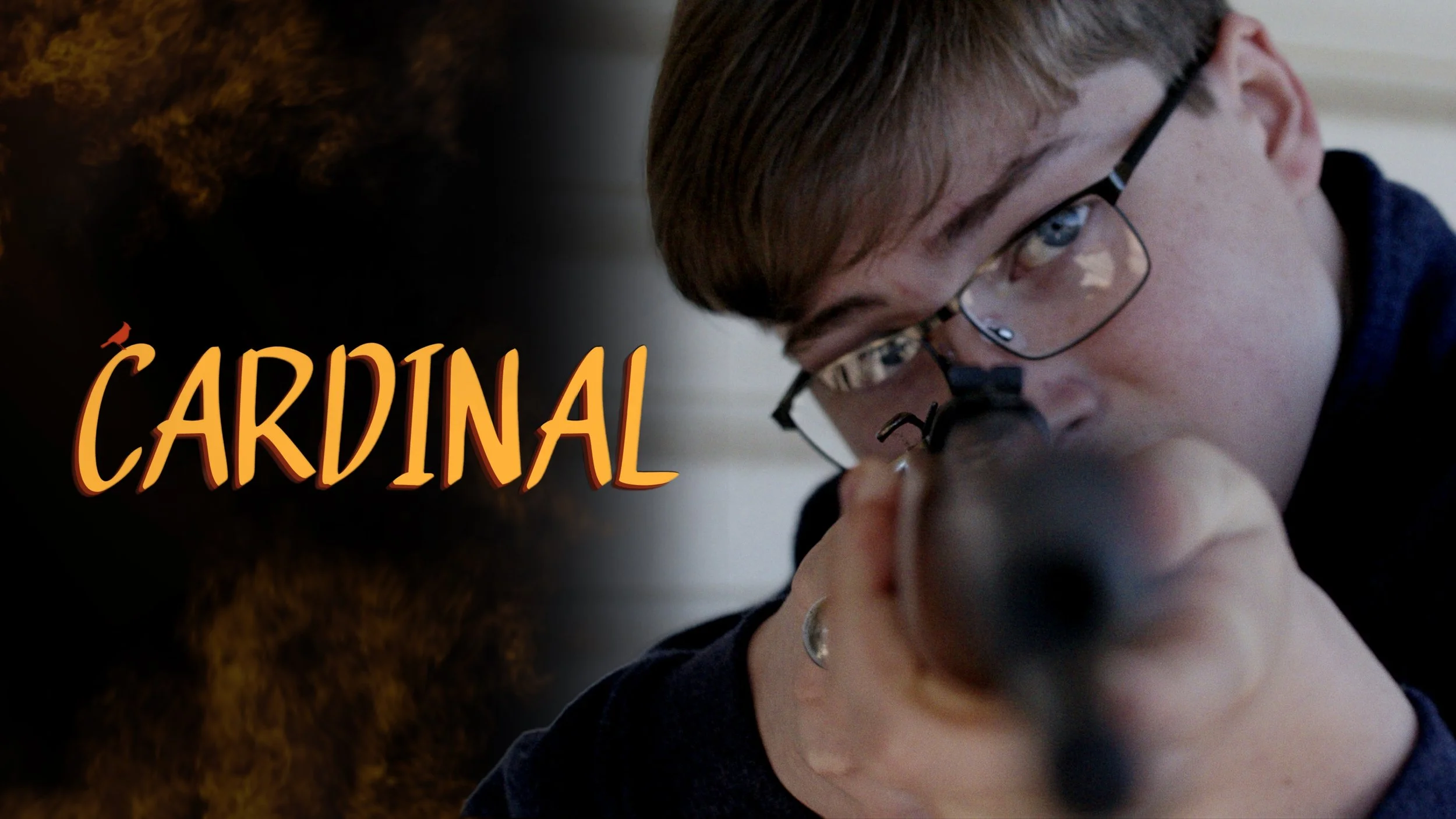 A young man with glasses aiming a firearm forward with a determined expression.