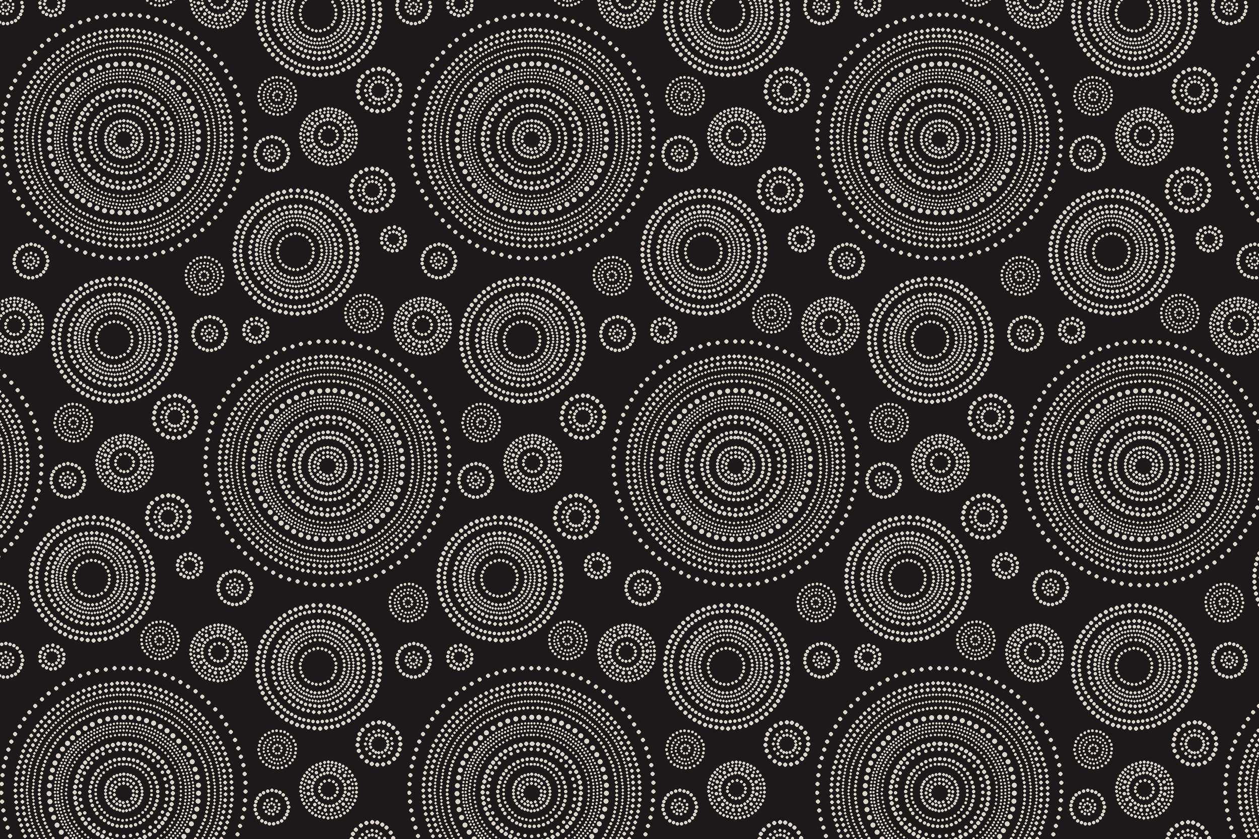 A pattern of numerous concentric circles made up of small white dots on a black background.