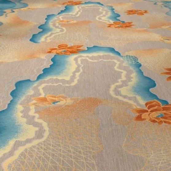 Axminster and Print Hospitality Carpets - suitable to pubs, clubs, hotels, bars:  Close-up of a patterned carpet with blue and beige colors, featuring floral designs and geometric shapes.