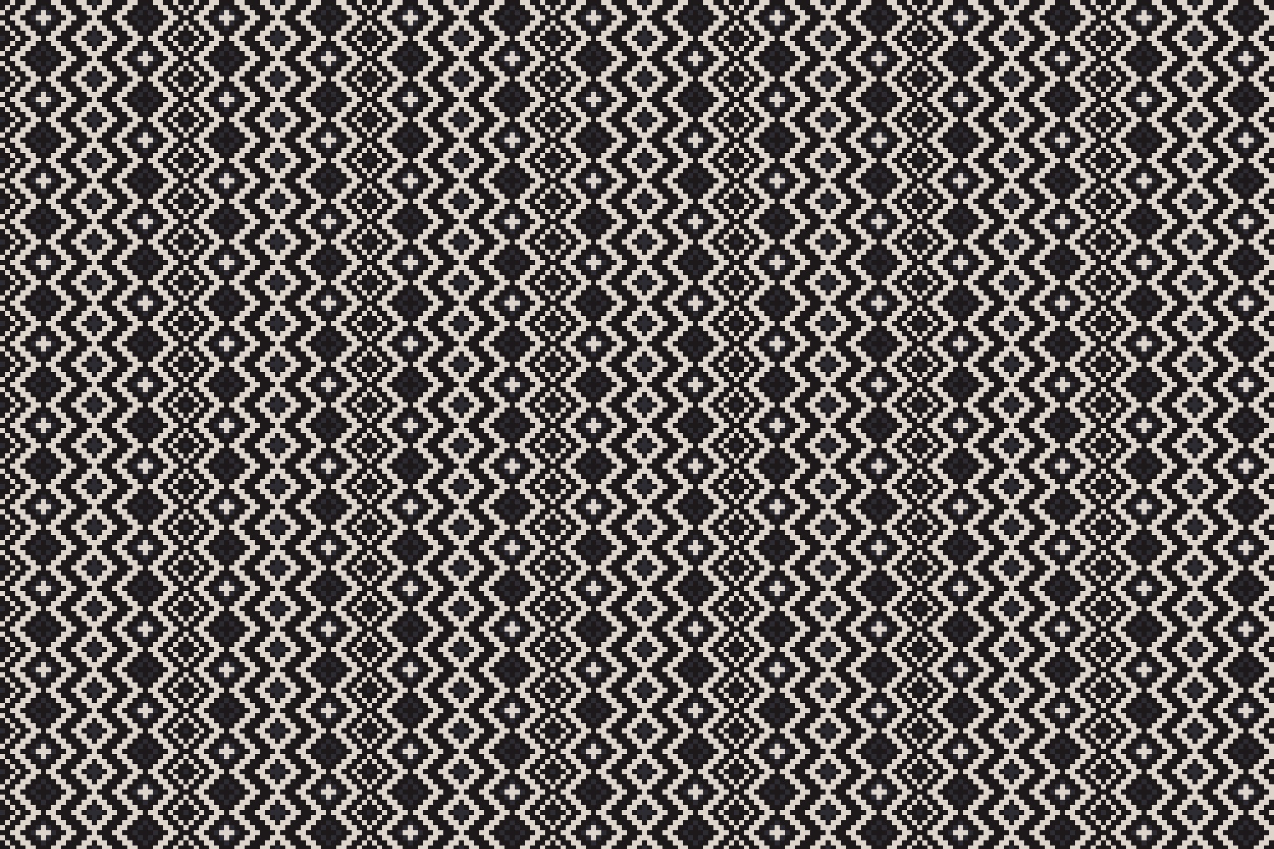 Black and white geometric patterned fabric with diamond and star shapes.