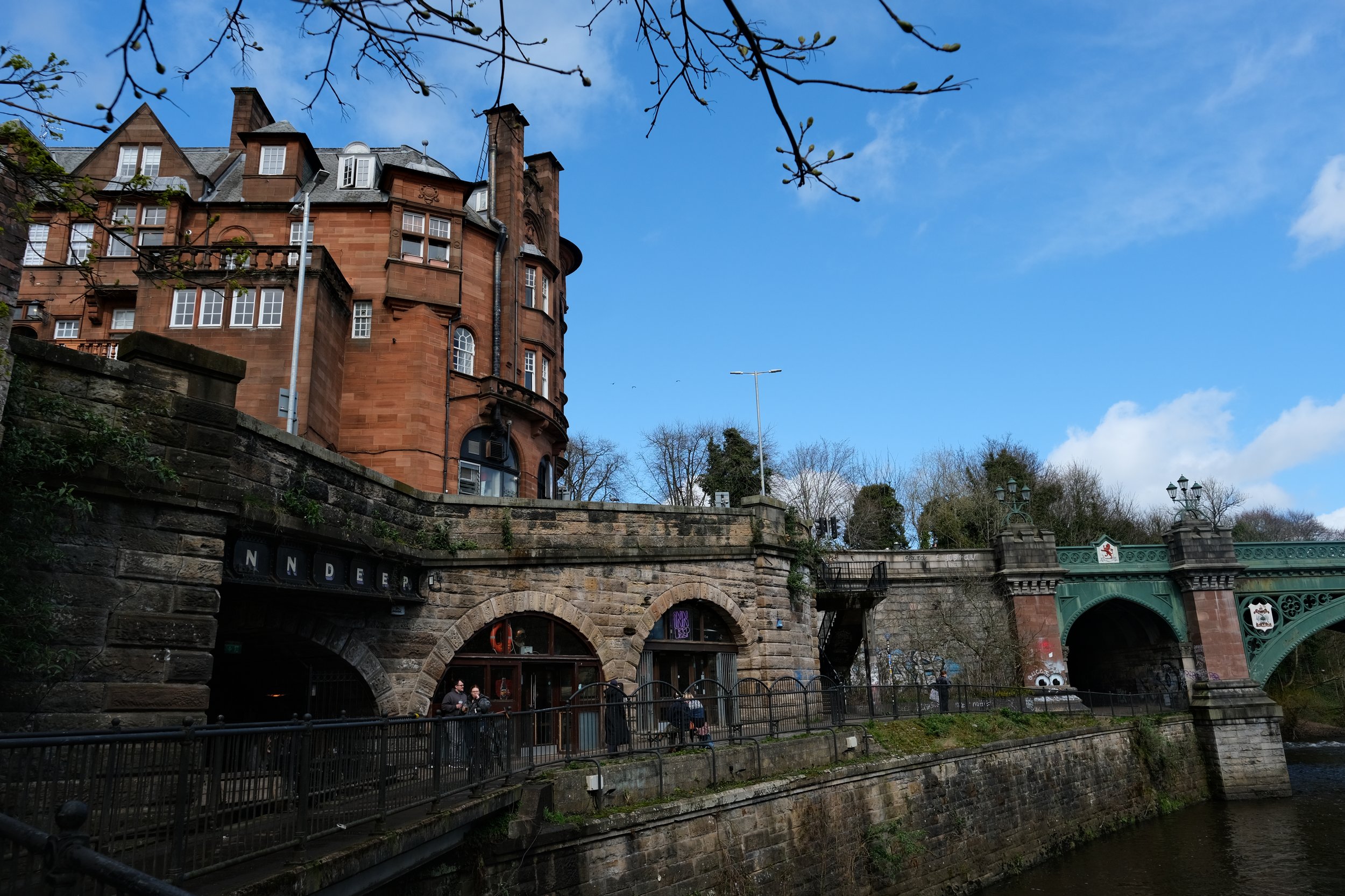 Bridge and building in Kelvingrove Park Glasgow Scotland