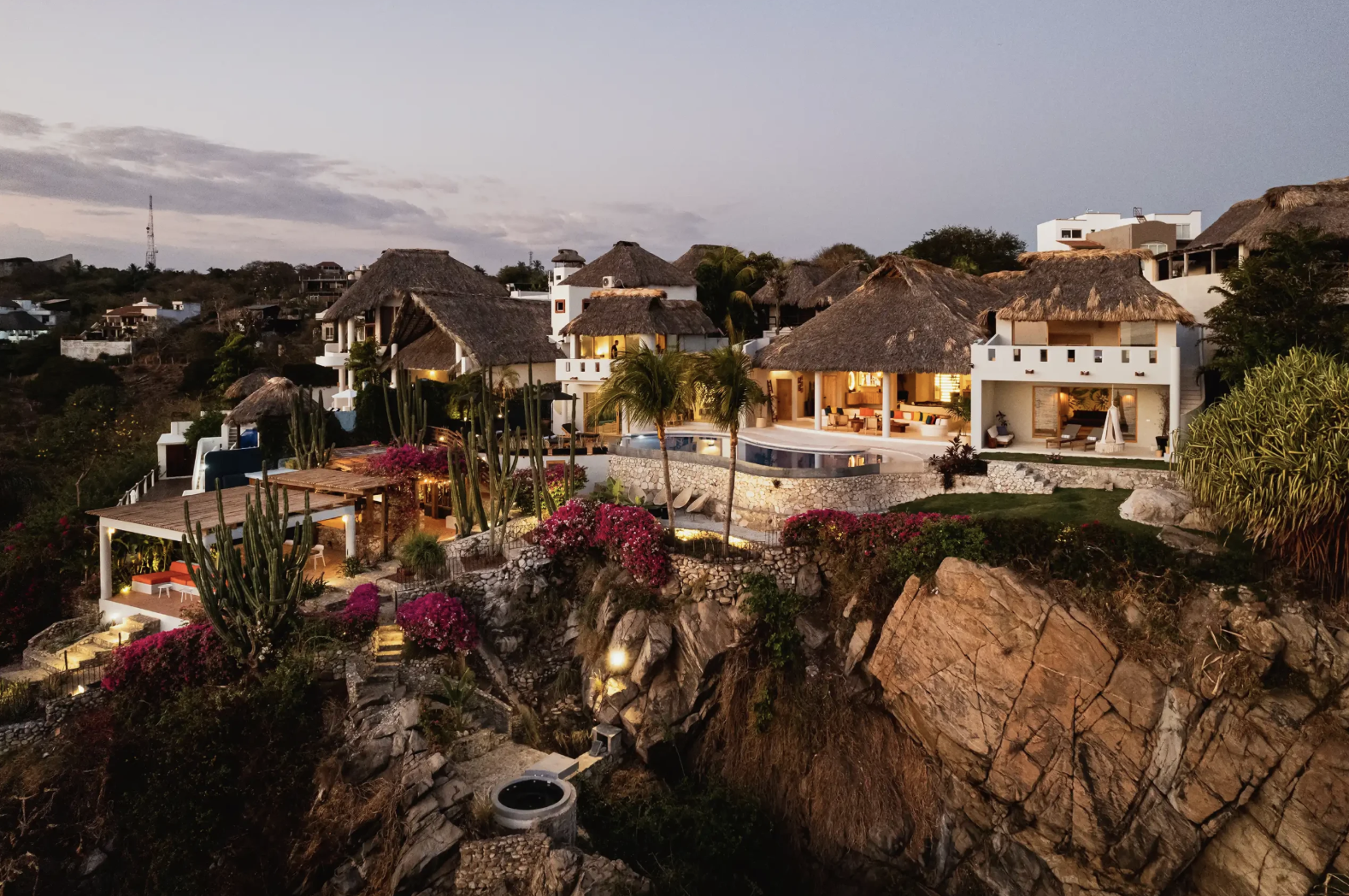 La Gema cliffside villa at dusk overlooking Puerto Escondido's coastline