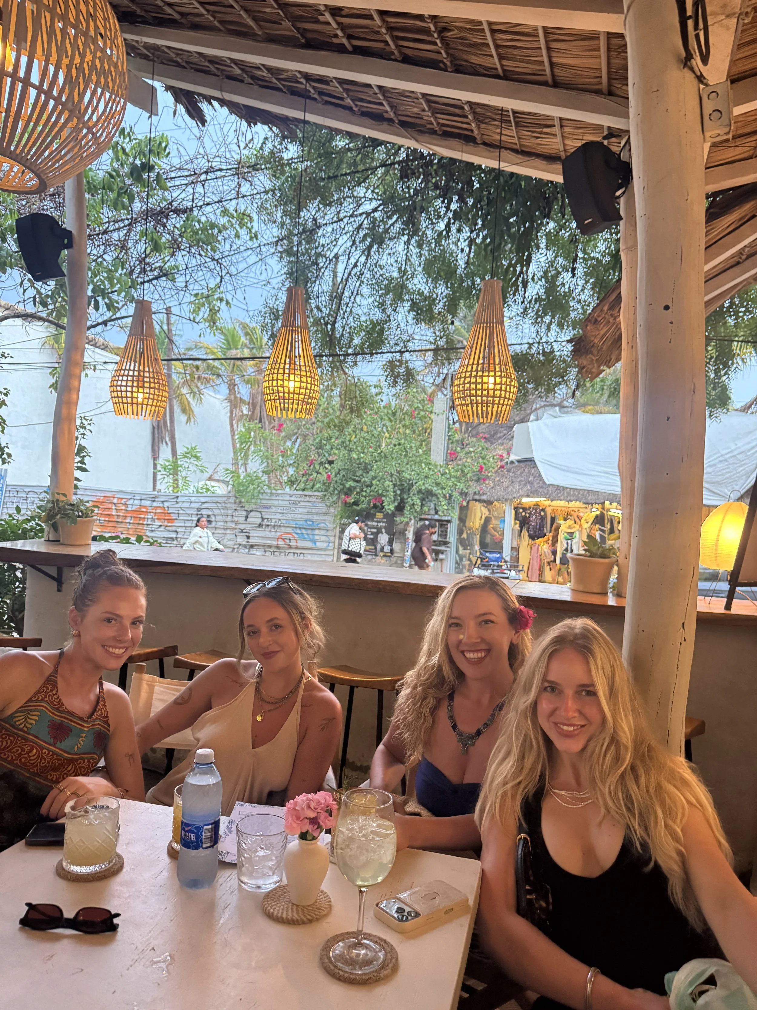 Friends at a boho-style restaurant in La Punta, Puerto Escondido