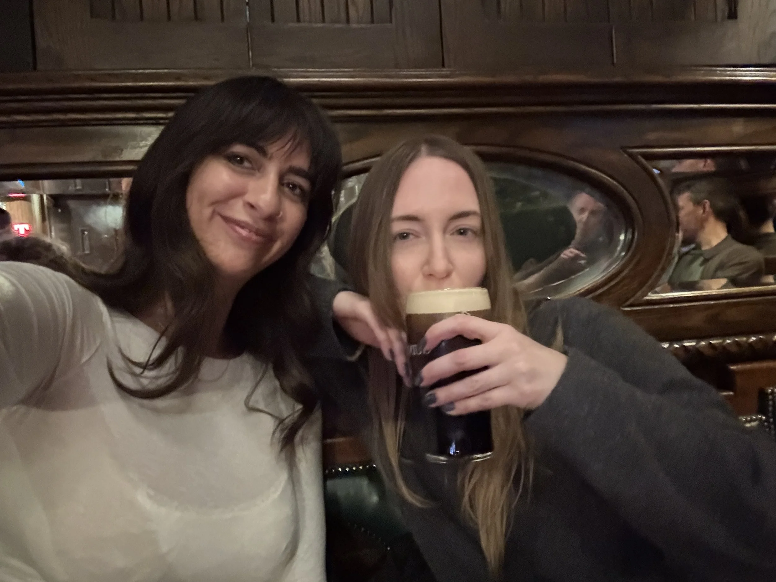 Girls drinking Guinness at a pub in Glasgow Scotland