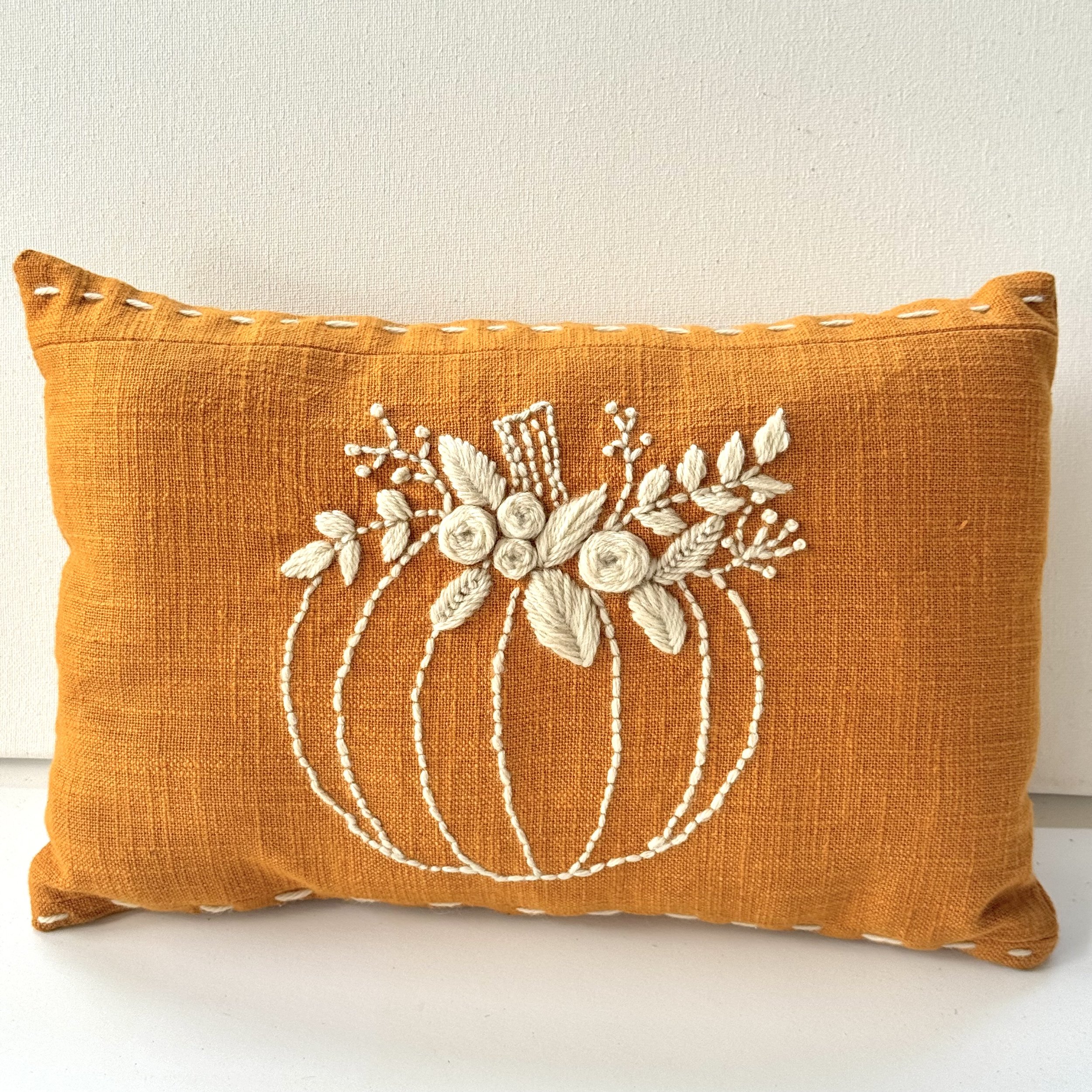 Hand embroidered pumpkin throw pillow
