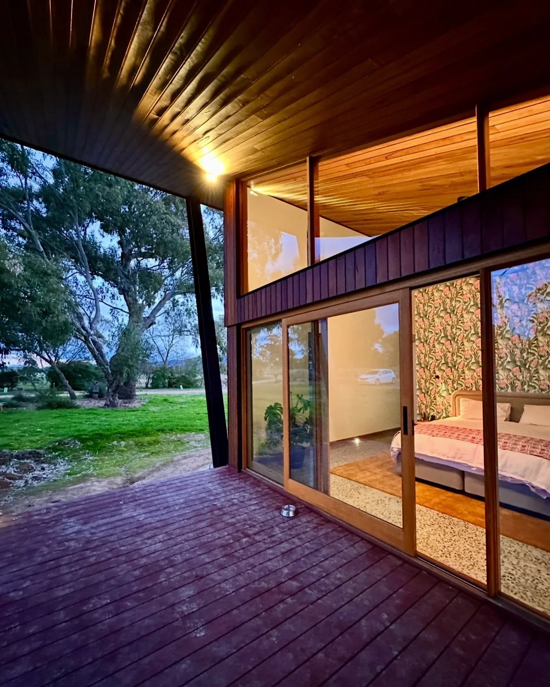 At Yarran House, the master bedroom feels like a cosy retreat. Soft light above the window fills the room, brightening when needed, while controlled reading lights on either side of the bed provide perfect illumination for reading. The window seat ha