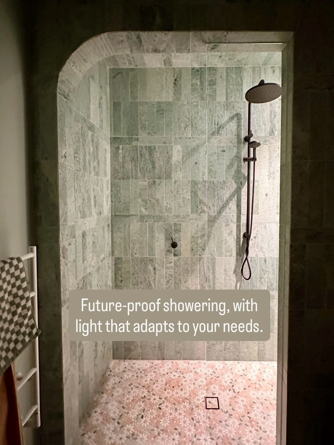 Carefully positioned grazing lights wash across the tilework in the shower, enhancing their detail. 

And two lighting modes allow for brighter mornings or softer evenings, and create a safe, inviting environment in a home built to support comfortabl